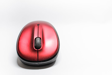 Modern red computer mouse on a white background