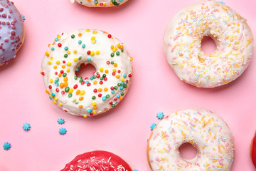 Sweet tasty donuts on color background