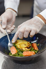 chef cooks a culinary dish in the restaurant kitchen.