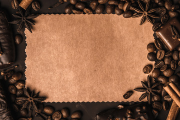 Appetizing food background. Sweets, coffee and spices around the card for notes.