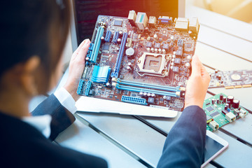 Engineer inspect final production of Printed circuit computer logic board prepare for mass...