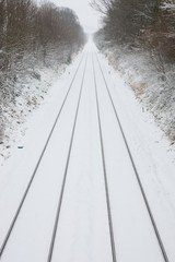 Dorking, Surrey, UK. Straight traintracks after fresh snow.