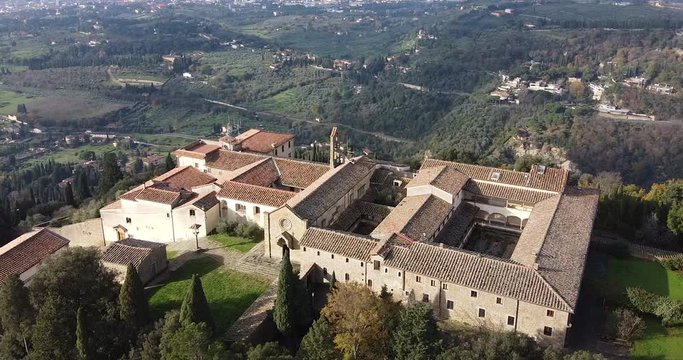 Orbit aerial view of Saint Francis San Francesco ancient medieval christian monastery. Fiesole hills near Florence, Tuscany Italy