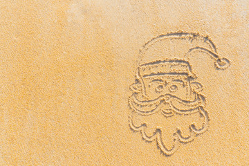 Concept Christmas on the beach Tropical design made in Phuket, Thailand Write the alphabet on the sand background Taken from real locations.
