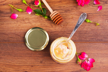 Delicious and healthy honey with rose sculpts, nutritious nuts and waffles. Perfect breakfast.