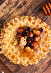 Delicious and healthy honey with rose sculpts, nutritious nuts and waffles. Perfect breakfast.