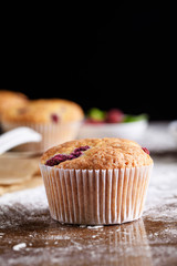 The process of baking delicious muffins with berries, white cream, chocolate.
