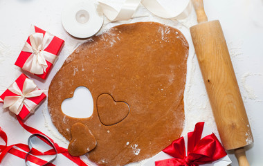 8 march, Valentine's day or mother's day baking culinary background, cooking recipe. gingerbread cookies on kitchen table and ingredients. For festive baking