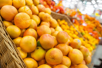Oranges on the counter in the grocery department of the store.