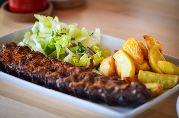 delicious smoked ribs with french fries & lettuce