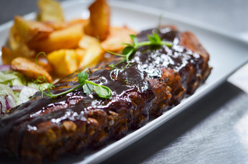 delicious smoked ribs with french fries & lettuce