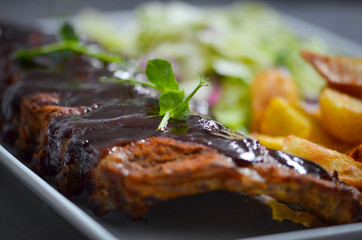 delicious smoked ribs with french fries & lettuce