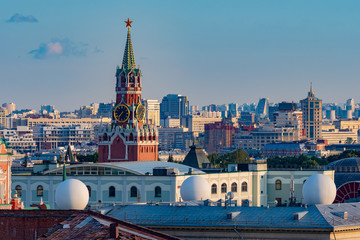 Fototapeta premium Moscow. Russia. The Roofs Of Moscow. Panorama of the center of the capital from a height. Architecture of Moscow. Sights Of Russia. Kremlin. Spasskaya tower with chimes.