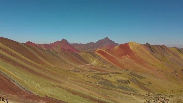 The Rainbow Mountain Peak at Vinicunca Valley. Spectacular mountain rainge in Andes plenty colors: orange, red, yellow, greens
