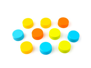 Colorful plastic bottle caps on white background. selective focus