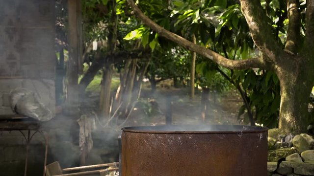 Burning old rubbish to create smoke. A common method of keeping mosquitos away in the Philippines
