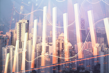 Forex graph on city view with skyscrapers background multi exposure. Financial analysis concept.
