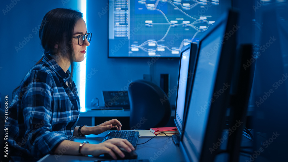 Poster Smart Female IT Engineer / Programer Working on Desktop Comuter. Software Development / Coding/ Web Design / Database Architecture. Young Girl STEM Graduate Working