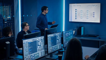 Team of Professional IT Developers Have Meeting, Speaker Talks about New Blockchain Based Software Development Shown on TV. Concept: Deep Learning, Artificial Intelligence, Data Mining, Neural Network