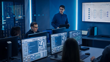 Team of Professional IT Developers Have Meeting, Speaker Talks about New Blockchain Based Software Development Shown on TV. Concept: Deep Learning, Artificial Intelligence, Data Mining, Neural Network