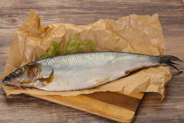 Salted herring over the wooden board