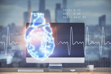 Desktop computer background and heart drawing. Double exposure. Medical study and healthcare concept.