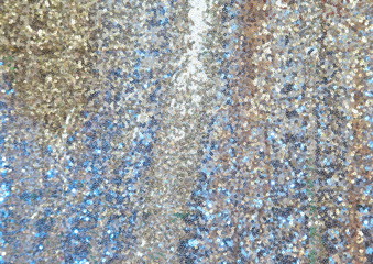 Colorful sequins - sparkling sequined textile, blurred