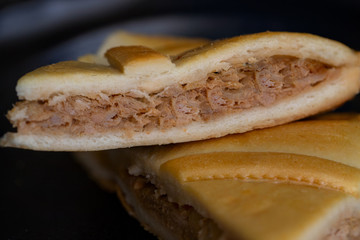 Empanada Gallega, Galician pie with tune, popular plate in Spanish cuisine. Close up, detail food background.