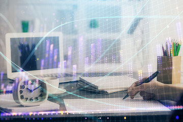 Financial graph displayed on woman's hand taking notes background. Concept of research. Multi exposure