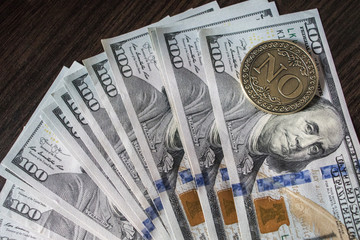 Dollars on the table with a Coin 
