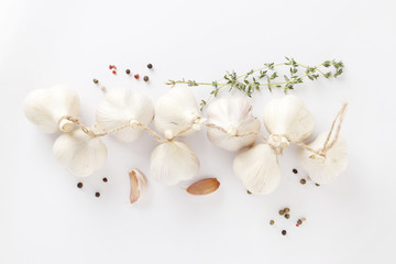 fresh garlic and spices on white background