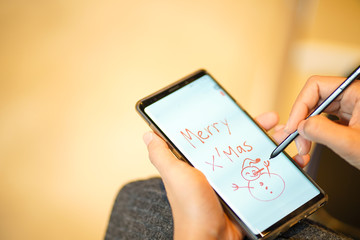 Writing Christmas greetings through mobile phone technology using current people's applications