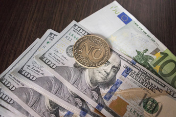 Euro and dollars on the table with a Coin 