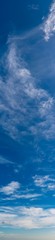 Fantastic clouds against blue sky, panorama