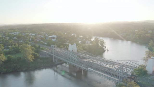 Sunset drone shot of the Walter Taylor Bridge over the Brisbane River, connecting Indooroopilly and Chelmer.
