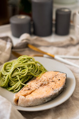salmon steak and vegetable spaghetti. close-up. Vegetarian food. 