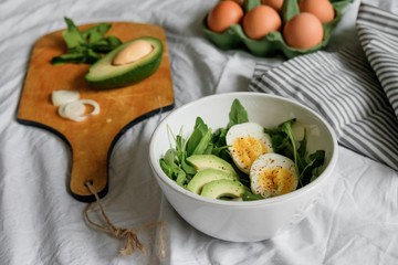 healthy green salad. Boiled eggs, herbs, onions and dressing. 