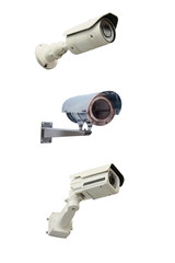 Three modern video cameras to track the situation at the object on a white background. Vertically