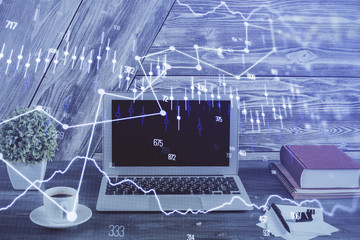 Multi exposure of graph and financial info and work space with computer background. Concept of international online trading.