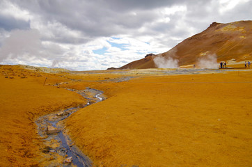 Supernatural landscape at geothermal field Mars like site Hverir Namafjall wasteland with pools of...