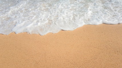 Fototapeta na wymiar Beautiful sea summer bstract background. Golden sand beach with blue waves ocean