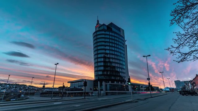Scandic Hotel building in Narvik, sunset time lapse vibrant fire sky motion blured traffic in Northern Norway lofoten