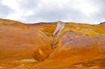 Supernatural landscape at geothermal field Mars like site Hverir Namafjall wasteland with pools of...