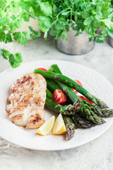 Fried cod fillet with green asparagus