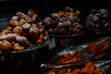 many rolls of different breads in the bakery restaurant