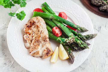 Fried cod fillet with green asparagus