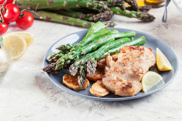Fried cod fillet with green asparagus