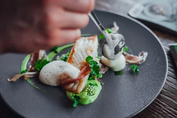 Keuken spatwand met foto Fish food on plate  in michelin star restaurant © Aleksandrs Muiznieks