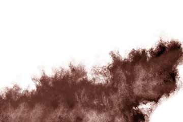 Brown color powder explosion on white background. 