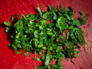 fresh chopped greens lying on a cutting board